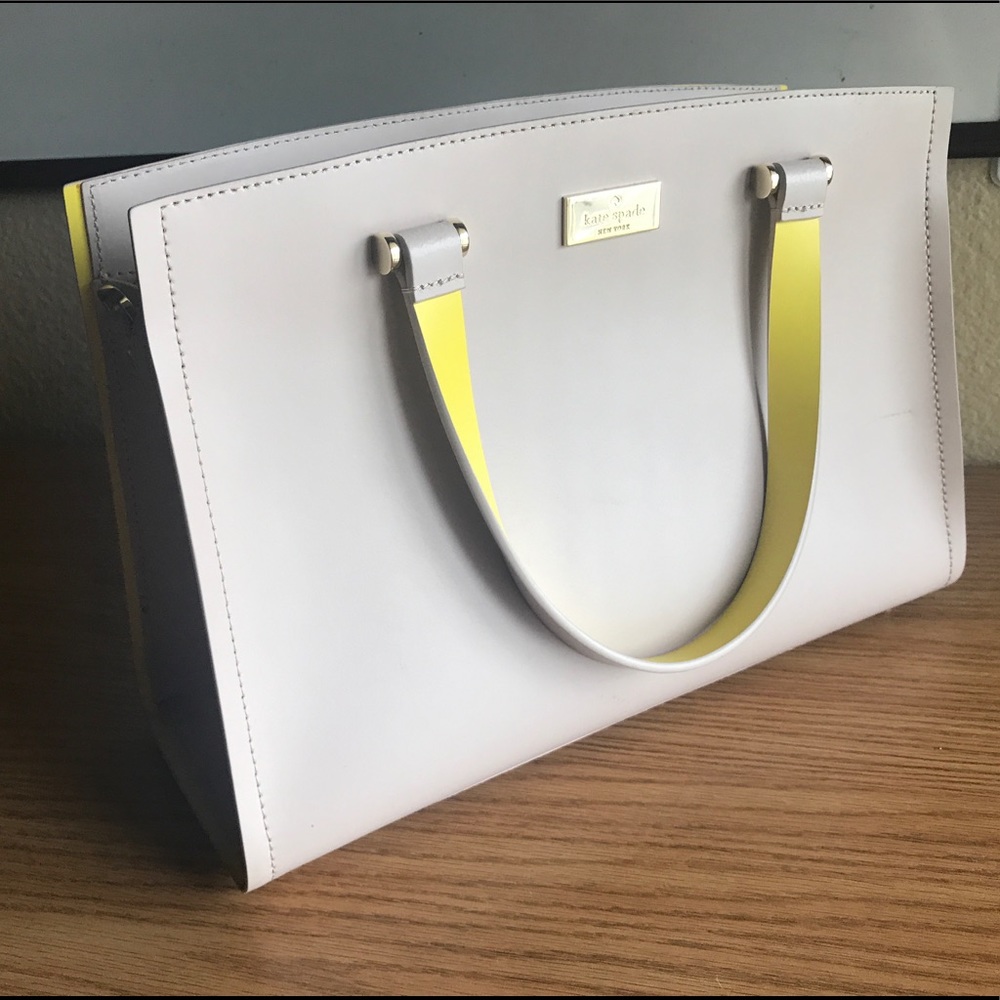 Kate spade tan purse with yellow lining